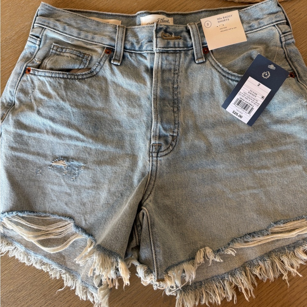 Universal Thread Light Blue Distressed Denim Shorts with Frayed Hem.